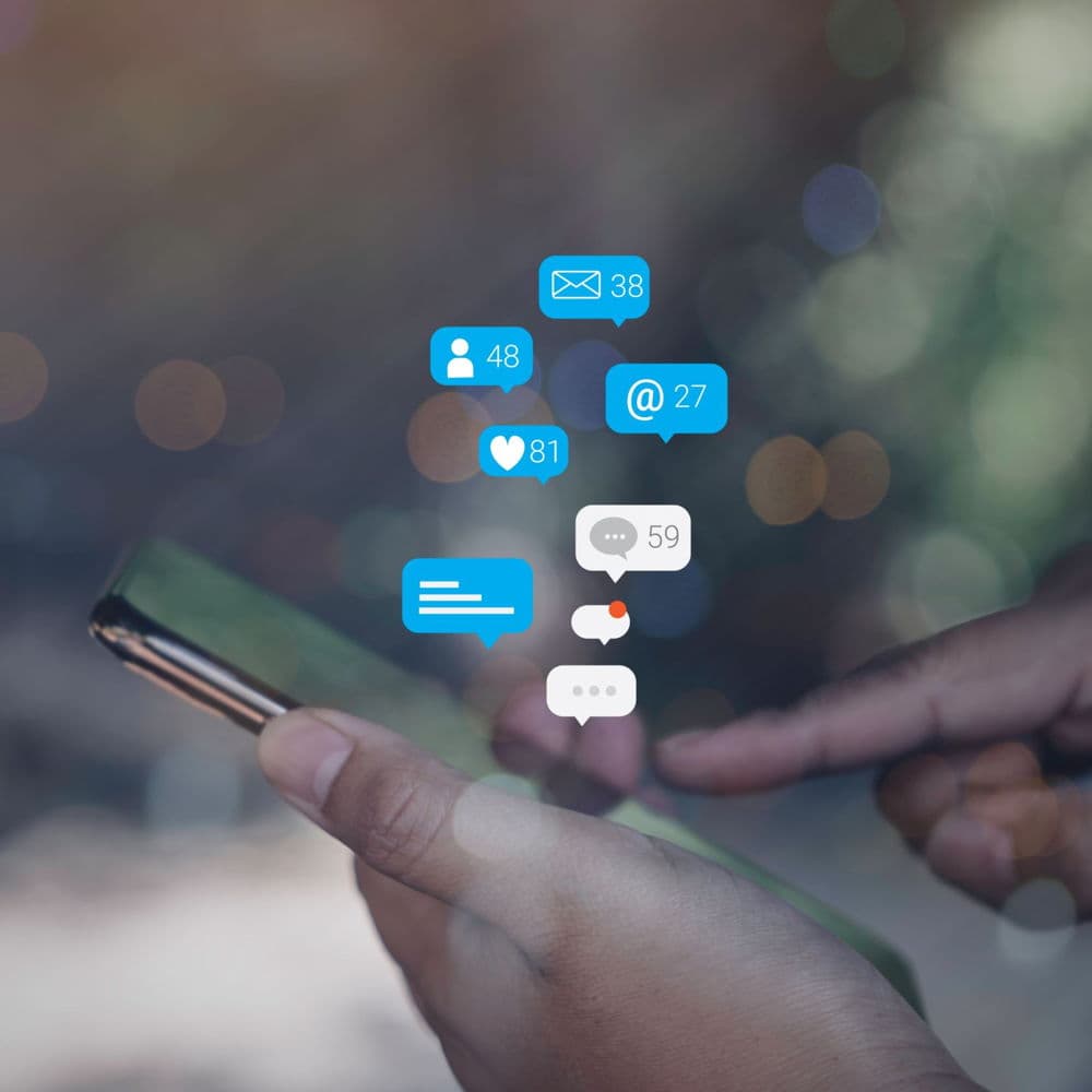 Phone showing social media interactions