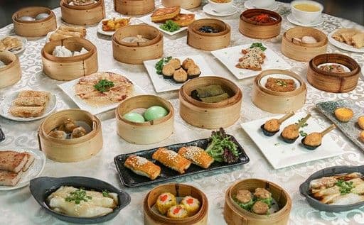 Dim sum dishes on a table representing traditional restaurants